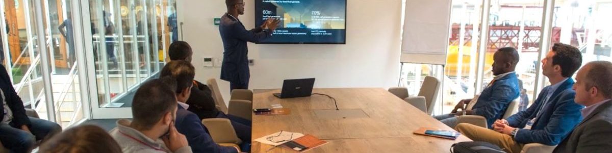 Man pitching to a room of investors